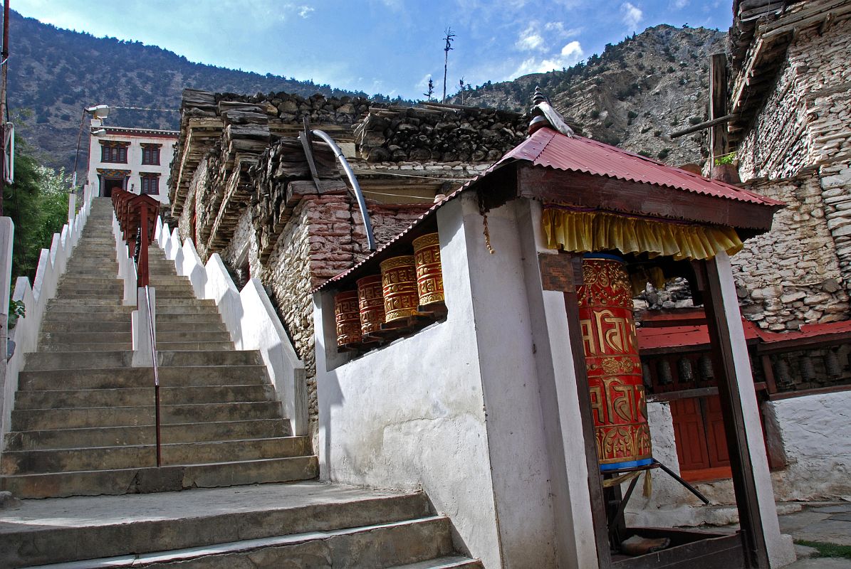 105 Marpha Tashi Lhakhang Gompa I visited Marpha's large impressive gompa, Tashi Lhakhang, which was renovated and enlarged in 1996. The gompa, as are all the buildings in Marpha, is painted with a whitewash that is produced from a special local stone